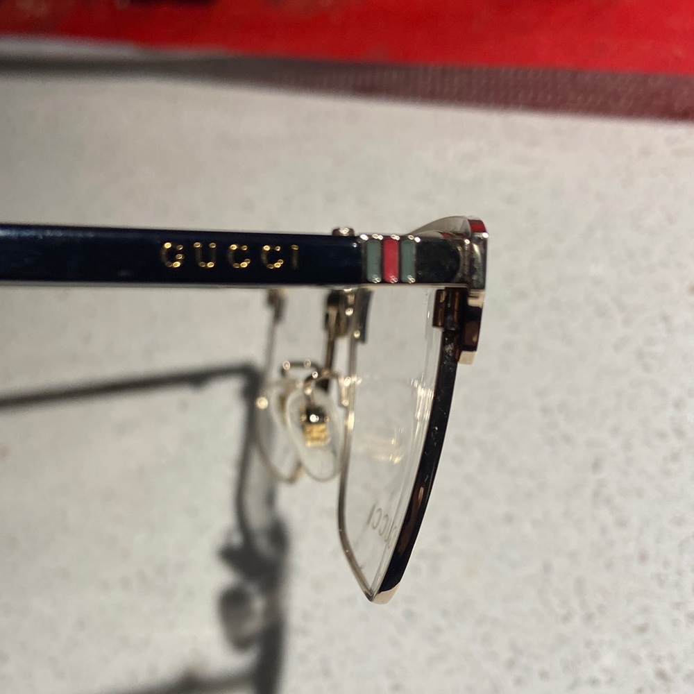 Gucci GG0130OZ 001 Elegant Black and Gold Eyewear - Picture 6 of 9